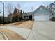 House exterior showcasing a light blue facade and a neatly manicured lawn at 4338 Braden Nw Ln, Kennesaw, GA 30144