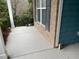 Covered front porch with gray concrete flooring and brick accent wall at 4338 Braden Nw Ln, Kennesaw, GA 30144