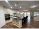 Modern kitchen with white cabinets, large island, and stainless steel appliances at 4338 Braden Nw Ln, Kennesaw, GA 30144