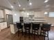 Modern kitchen with white cabinets, granite countertops and stainless steel appliances at 4338 Braden Nw Ln, Kennesaw, GA 30144