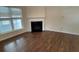 Living room with hardwood floors and fireplace at 4338 Braden Nw Ln, Kennesaw, GA 30144