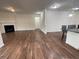 Spacious living room featuring hardwood floors and fireplace at 4338 Braden Nw Ln, Kennesaw, GA 30144