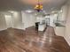 Open concept living room with hardwood floors and kitchen view at 4338 Braden Nw Ln, Kennesaw, GA 30144