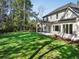 Large backyard with expansive lawn and tree-lined borders at 754 Moon Road, Lawrenceville, GA 30046