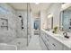 Elegant bathroom featuring a walk-in shower and double vanity at 754 Moon Road, Lawrenceville, GA 30046