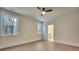 Light-filled bedroom with hardwood floors and access to bathroom at 754 Moon Road, Lawrenceville, GA 30046