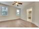 Bright bedroom with hardwood floors and ceiling fan at 754 Moon Rd, Lawrenceville, GA 30046