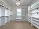 Large walk-in closet with ample shelving and hanging space at 754 Moon Rd, Lawrenceville, GA 30046