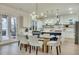 Modern kitchen with white cabinets, glass doors, and island at 754 Moon Rd, Lawrenceville, GA 30046