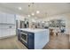 Open kitchen with island, stainless steel appliances, and views to Gathering room at 754 Moon Rd, Lawrenceville, GA 30046