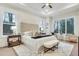 Spacious main bedroom with tufted headboard and large windows at 754 Moon Road, Lawrenceville, GA 30046