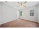 Well-lit bedroom with ceiling fan, carpet and windows at 1546 Richland Sw Rd, Atlanta, GA 30311