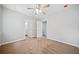 Well-lit bedroom with ceiling fan and plush carpeting at 1546 Richland Sw Rd, Atlanta, GA 30311