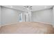 Spacious bedroom with neutral carpeting and ceiling fan at 1546 Richland Sw Rd, Atlanta, GA 30311