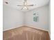Spacious bedroom with ceiling fan, carpet, and window at 1546 Richland Sw Rd, Atlanta, GA 30311