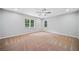 Spacious bedroom with neutral carpeting and ceiling fan at 1546 Richland Sw Rd, Atlanta, GA 30311