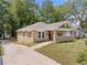 Charming renovated brick home with a covered porch and well-manicured lawn at 1546 Richland Sw Rd, Atlanta, GA 30311