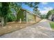 Green house with a large backyard and a long driveway at 1546 Richland Sw Rd, Atlanta, GA 30311