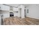 Modern kitchen with white cabinets, granite counters, and stainless steel appliances at 1546 Richland Sw Rd, Atlanta, GA 30311