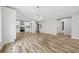 Open concept kitchen and dining area with stainless steel appliances and wood-look floors at 1546 Richland Sw Rd, Atlanta, GA 30311