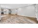 Open living room with wood-look floors and neutral walls at 1546 Richland Sw Rd, Atlanta, GA 30311