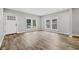 Bright living room with hardwood floors and multiple windows at 1546 Richland Sw Rd, Atlanta, GA 30311