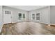 Bright living room features hardwood floors and multiple windows at 1546 Richland Sw Rd, Atlanta, GA 30311