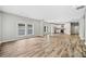 Open concept living space with hardwood floors, kitchen, and dining area at 1546 Richland Sw Rd, Atlanta, GA 30311