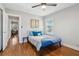 Bedroom with hardwood floors and access to another room at 2332 Candler Rd, Decatur, GA 30032