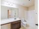 Bathroom featuring a sink, vanity, toilet, and shower-tub combo at 3535 Clarecastle Dr, Buford, GA 30519