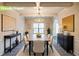 Elegant dining room showcasing stylish decor, coffered ceiling, and a large table for gatherings at 3535 Clarecastle Dr, Buford, GA 30519