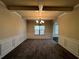 Formal dining room with a chandelier, tray ceiling, and hardwood floors at 3535 Clarecastle Dr, Buford, GA 30519