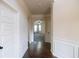 Entryway with hardwood floors, white wainscoting, and arched openings at 3535 Clarecastle Dr, Buford, GA 30519