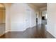 Entryway with hardwood floors, white wainscoting, and arched openings at 3535 Clarecastle Dr, Buford, GA 30519