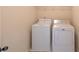 Small laundry room featuring a washer and dryer at 3535 Clarecastle Dr, Buford, GA 30519