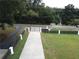 Long driveway leading to a home with a black gate at 7540 Union Grove Rd, Lithonia, GA 30058