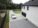 Attached two-car garage with a modern black door at 7540 Union Grove Rd, Lithonia, GA 30058