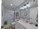 Spa-like bathroom with a walk-in shower, white subway tile and modern vanity at 100 Verlaine Nw Pl, Atlanta, GA 30327