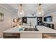 Modern kitchen with island, sink, and stainless steel appliances at 100 Verlaine Nw Pl, Atlanta, GA 30327