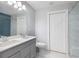 Bathroom with double vanity and blue tile shower at 1482 Andrews Nw St, Atlanta, GA 30314