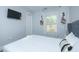 Bright bedroom with a comfortable queen-size bed and TV at 1482 Andrews Nw St, Atlanta, GA 30314