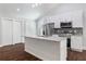 Modern kitchen with white cabinets, granite island, and stainless steel appliances at 1482 Andrews Nw St, Atlanta, GA 30314