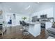 Open concept kitchen with island seating and stylish light fixtures at 1482 Andrews Nw St, Atlanta, GA 30314