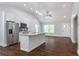 Open concept kitchen with stainless steel appliances and hardwood floors at 1482 Andrews Nw St, Atlanta, GA 30314