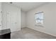 Cozy bedroom with carpet flooring, large window, and closet at 2540 Canning View Ave, Lawrenceville, GA 30044