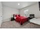 Simple bedroom with a red bedspread and a home office at 2540 Canning View Ave, Lawrenceville, GA 30044