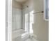 Updated bathroom with marble tile shower and tub at 3489 Pine Forest Se Dr, Atlanta, GA 30354