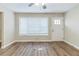 Living room featuring hardwood floors and large windows at 3489 Pine Forest Se Dr, Atlanta, GA 30354