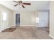 Large living room with carpet, access to exterior and closets at 3489 Pine Forest Se Dr, Atlanta, GA 30354