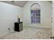 Bright bedroom featuring a large window and neutral carpeting at 3877 Oakman Pl, Fairburn, GA 30213